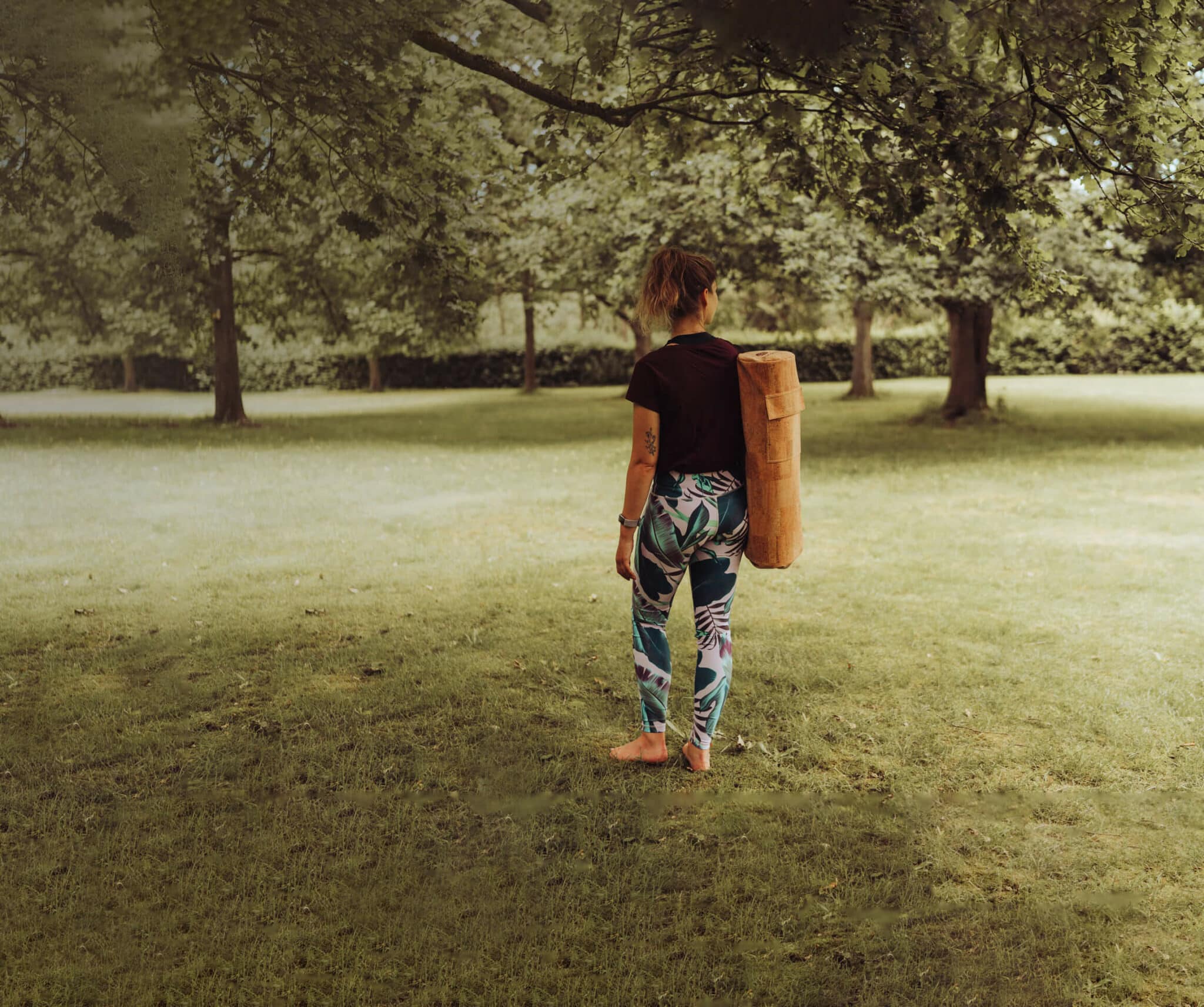 Woman Carrying PIERRE Cork Yoga Mat
