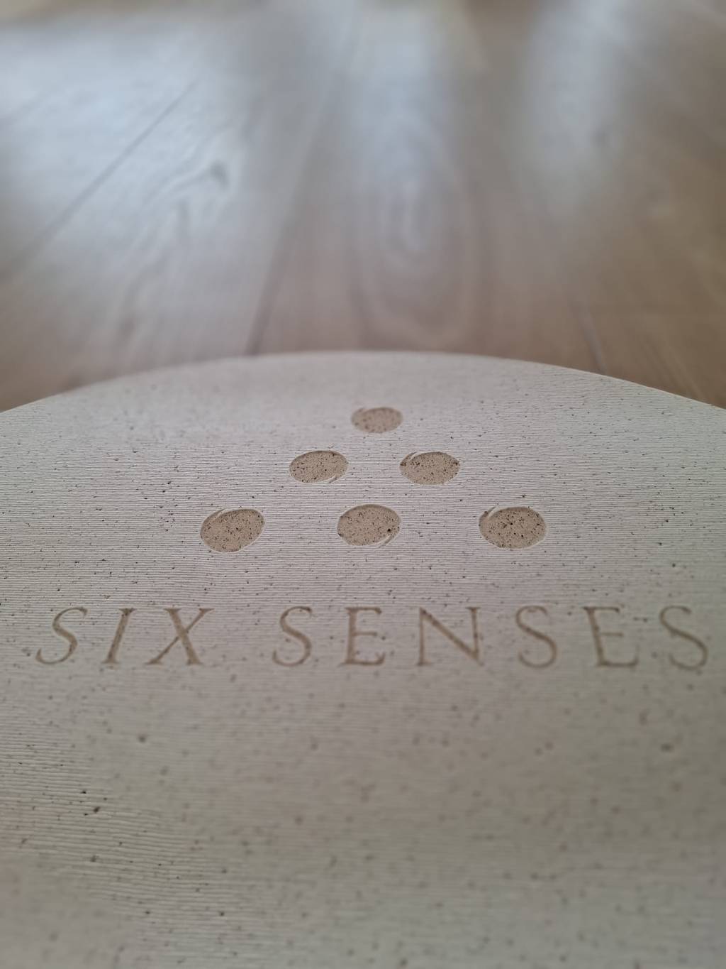 Six Senses logo embossed into a natural cork yoga mat