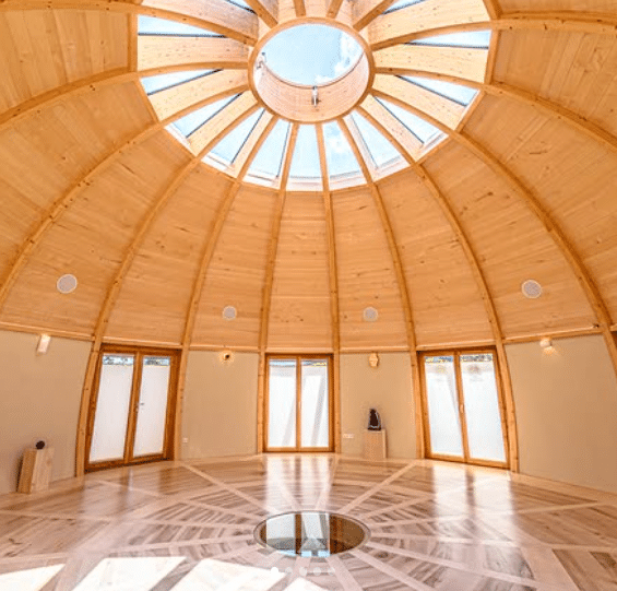 Sunlit Interior Of Wooden Dome Yoga Studio