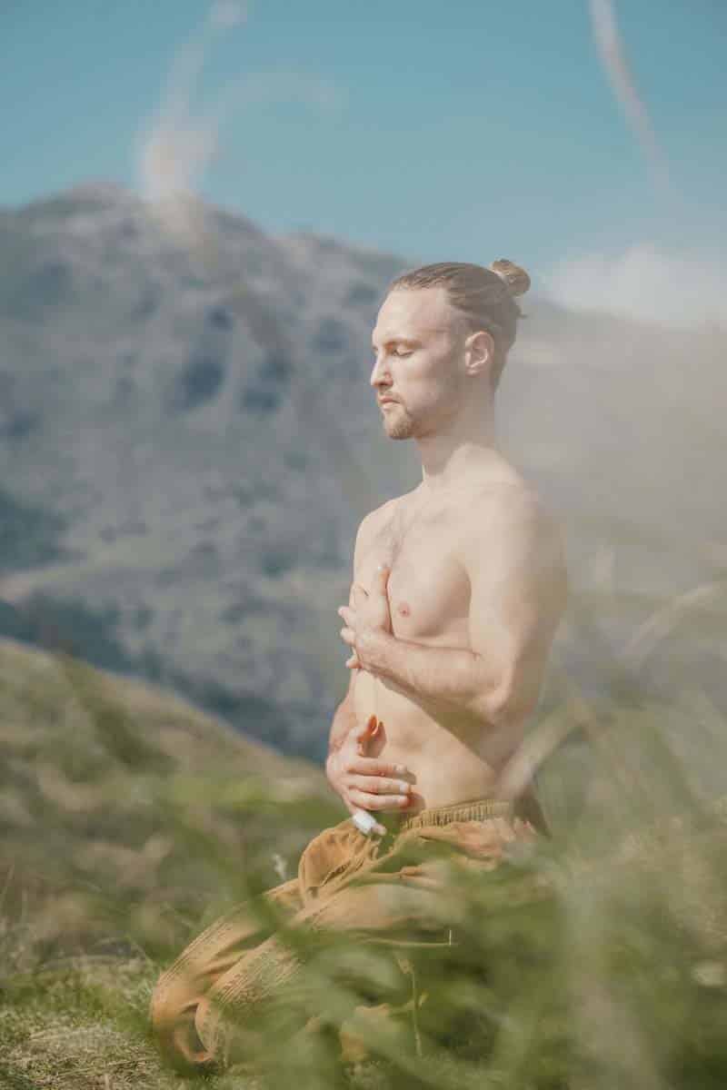 Man Meditating In The Mountains