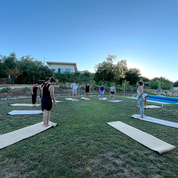 Outdoor Group Yoga Session on Grass
