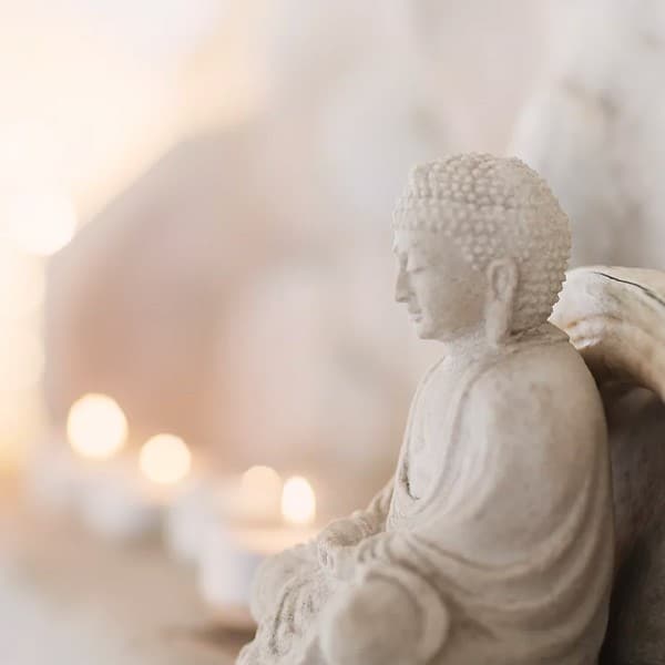 Stone Buddha Statue with Bokeh Candles