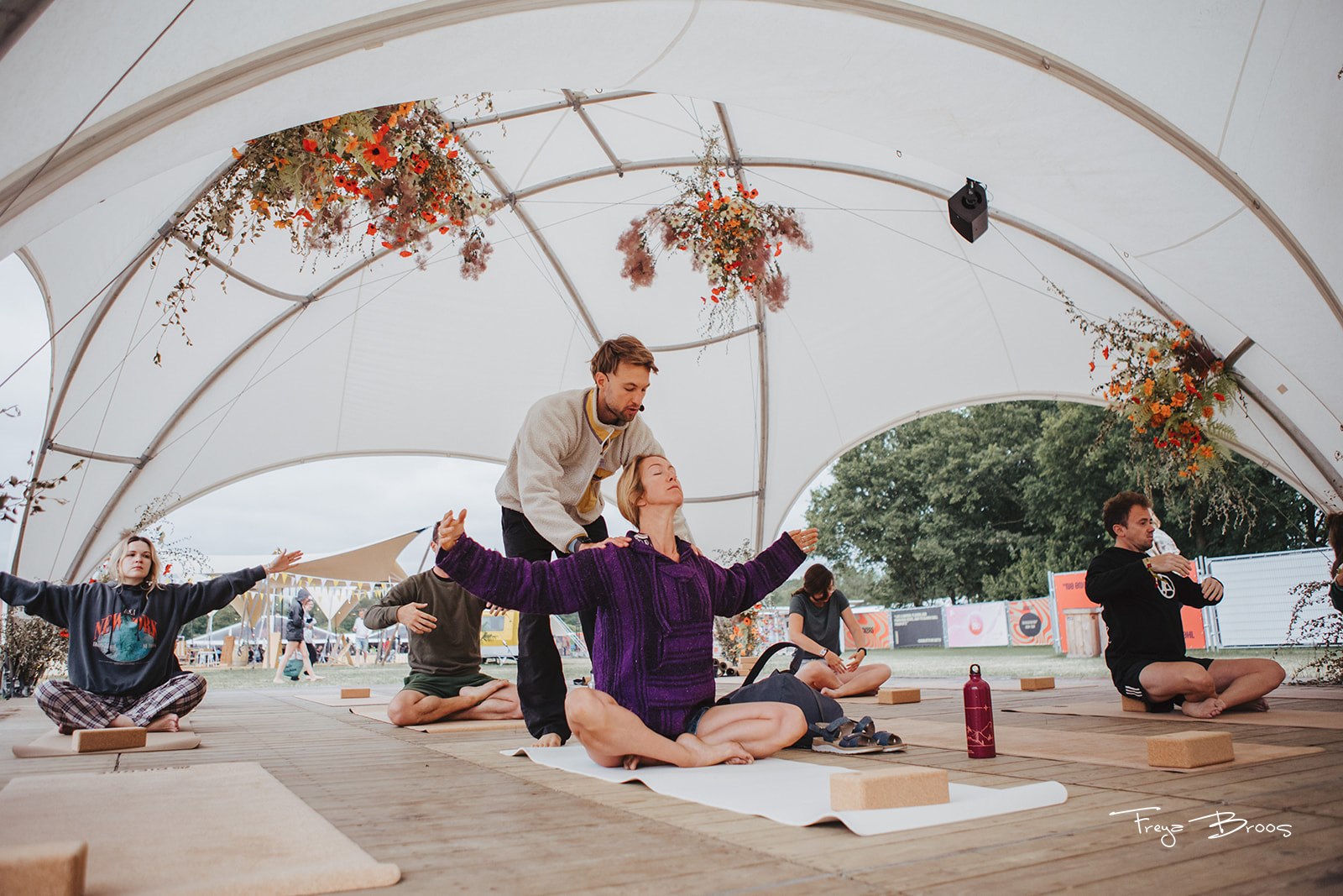 Festival Dome Teacher Assisting Seated Pair