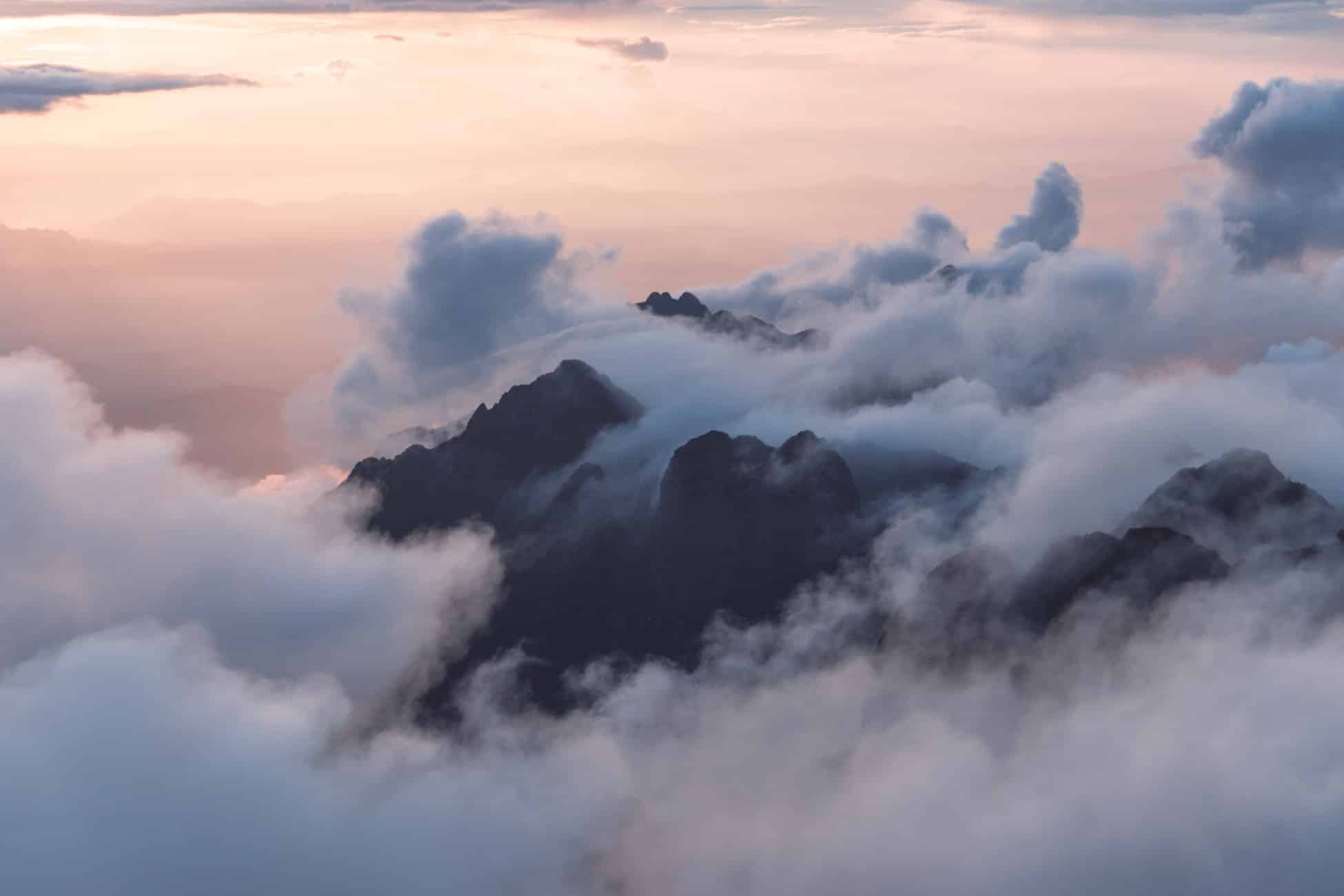 Misty Mountain Peaks At Sunset