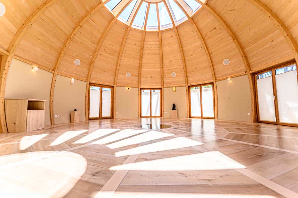 Sunlit Interior Of Wooden Dome Yoga Studio
