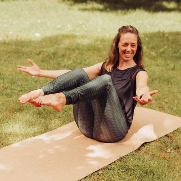 Woman Doing Boat Pose On PIERRE Cork Yoga Mat