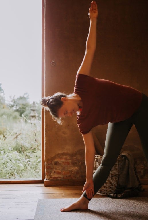Woman Doing Triangle Pose on PIERRE Mat