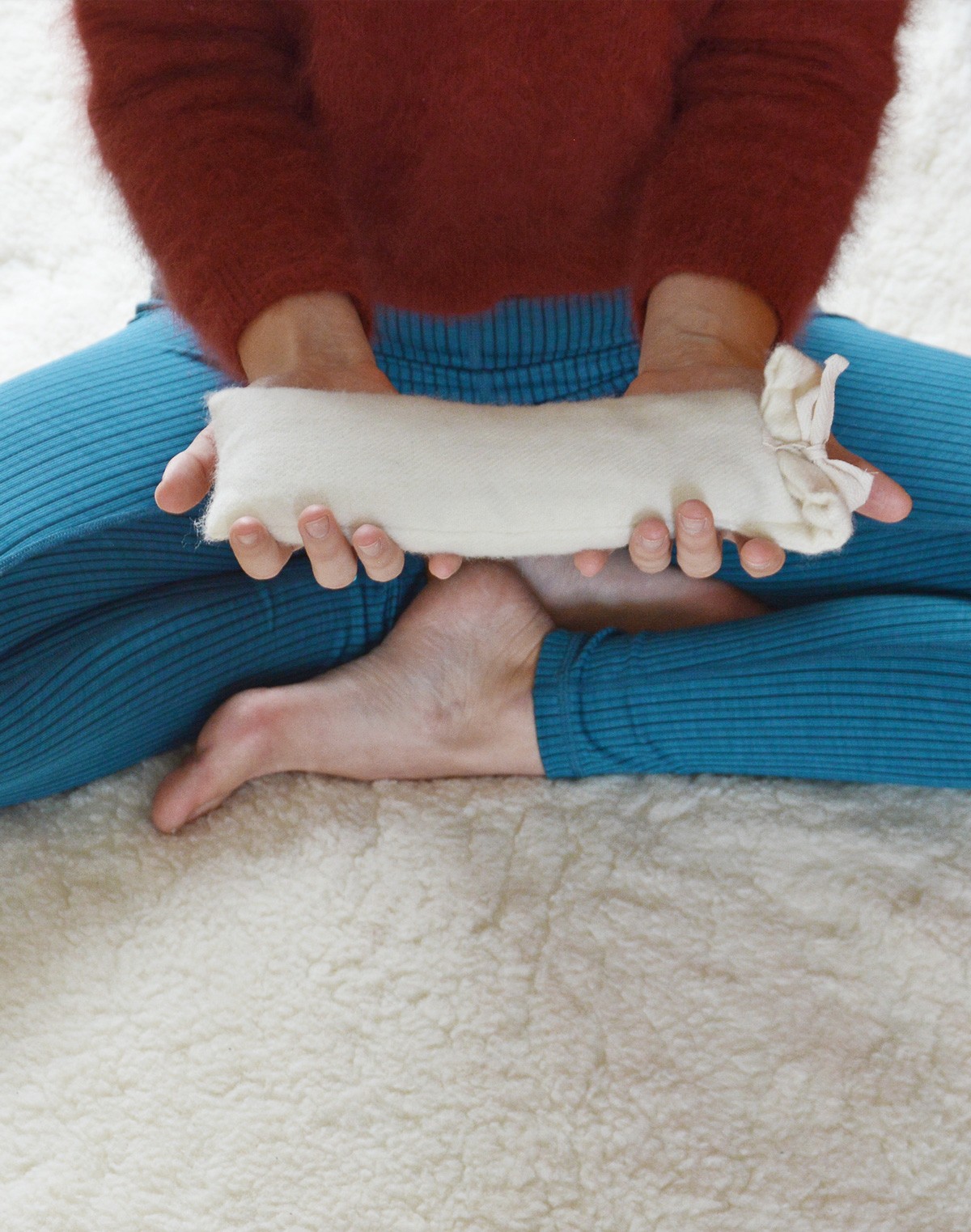 PIERRE Wool Eye Pillow Held by Woman
