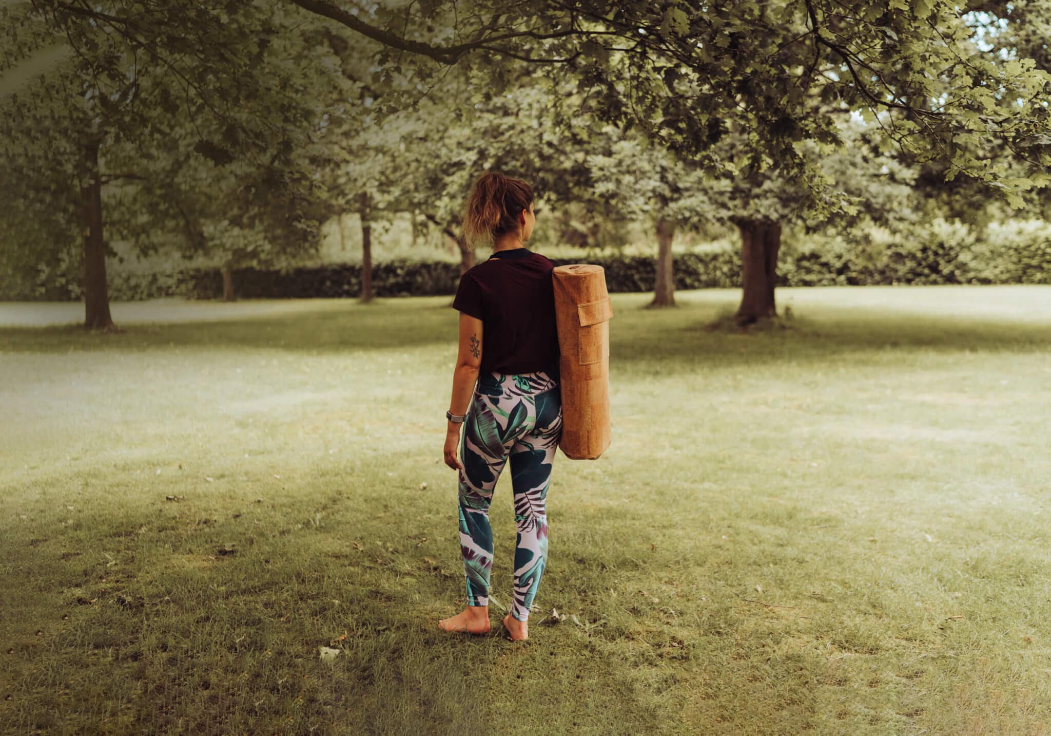 Woman Carrying PIERRE Cork Yoga Mat