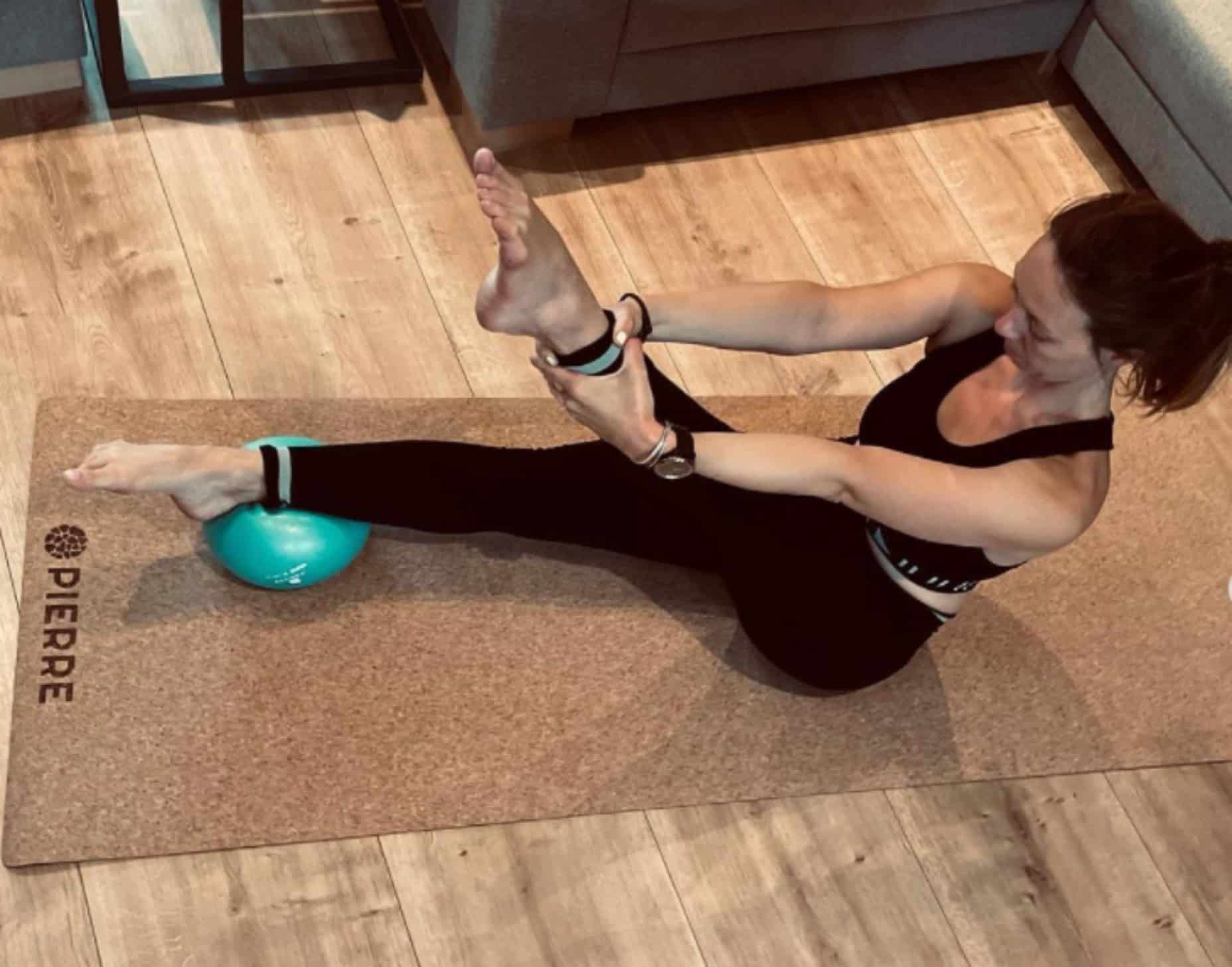 Woman Practicing Pilates On PIERRE Mat
