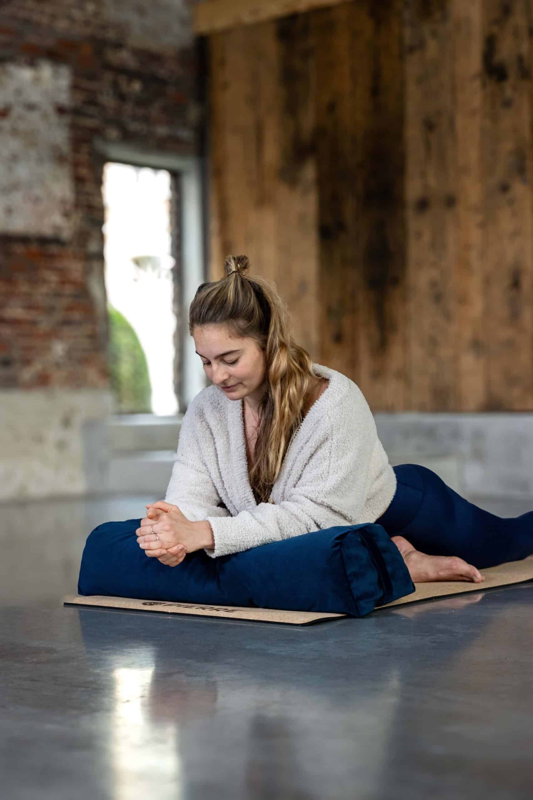 Woman Practicing Restorative Yoga PIERRE