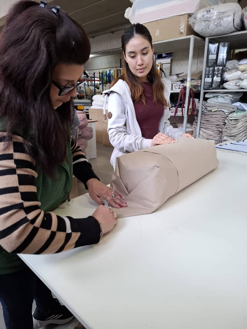 Packing a finished yoga mat in the workshop