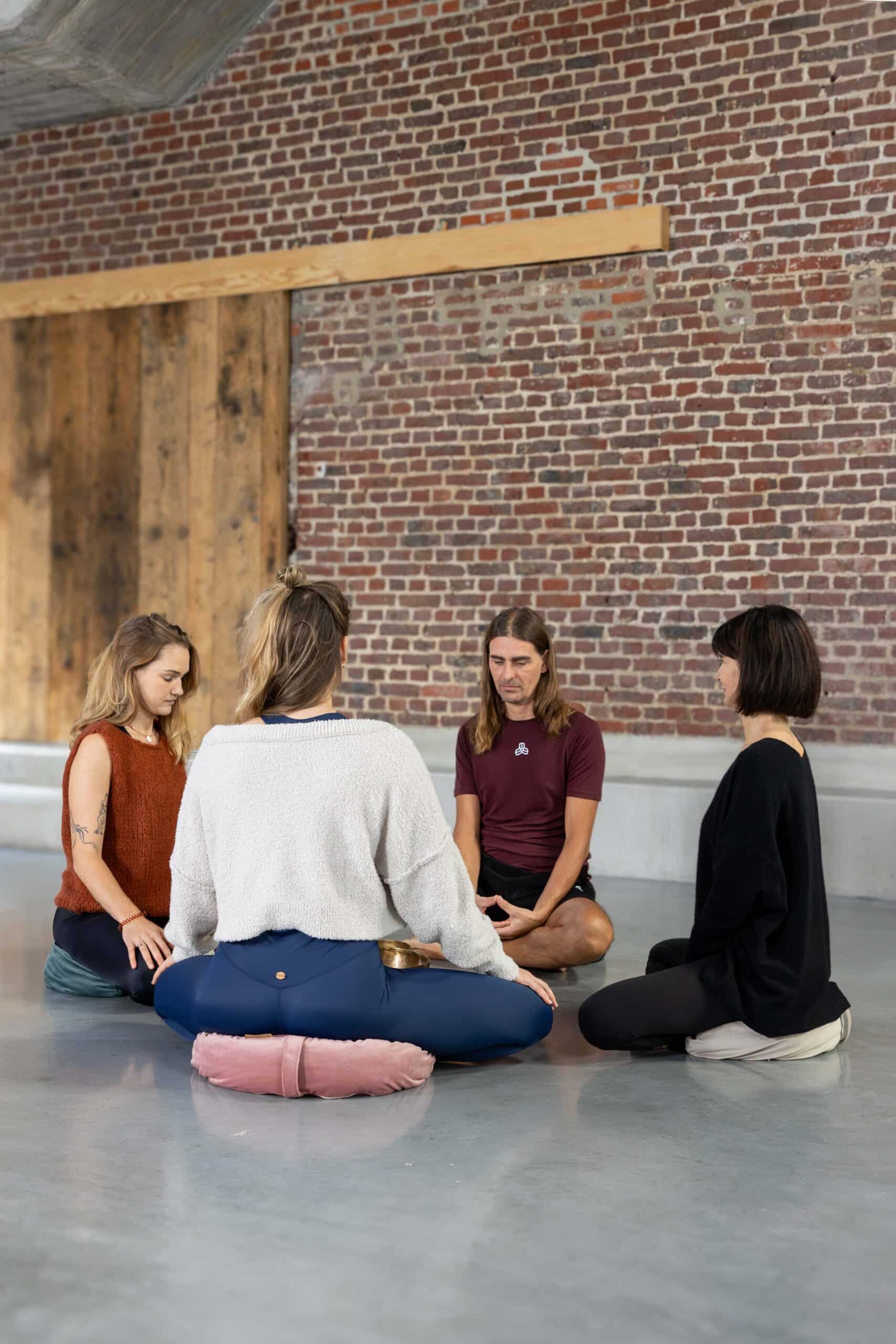 Group Meditation In Industrial Yoga Studio