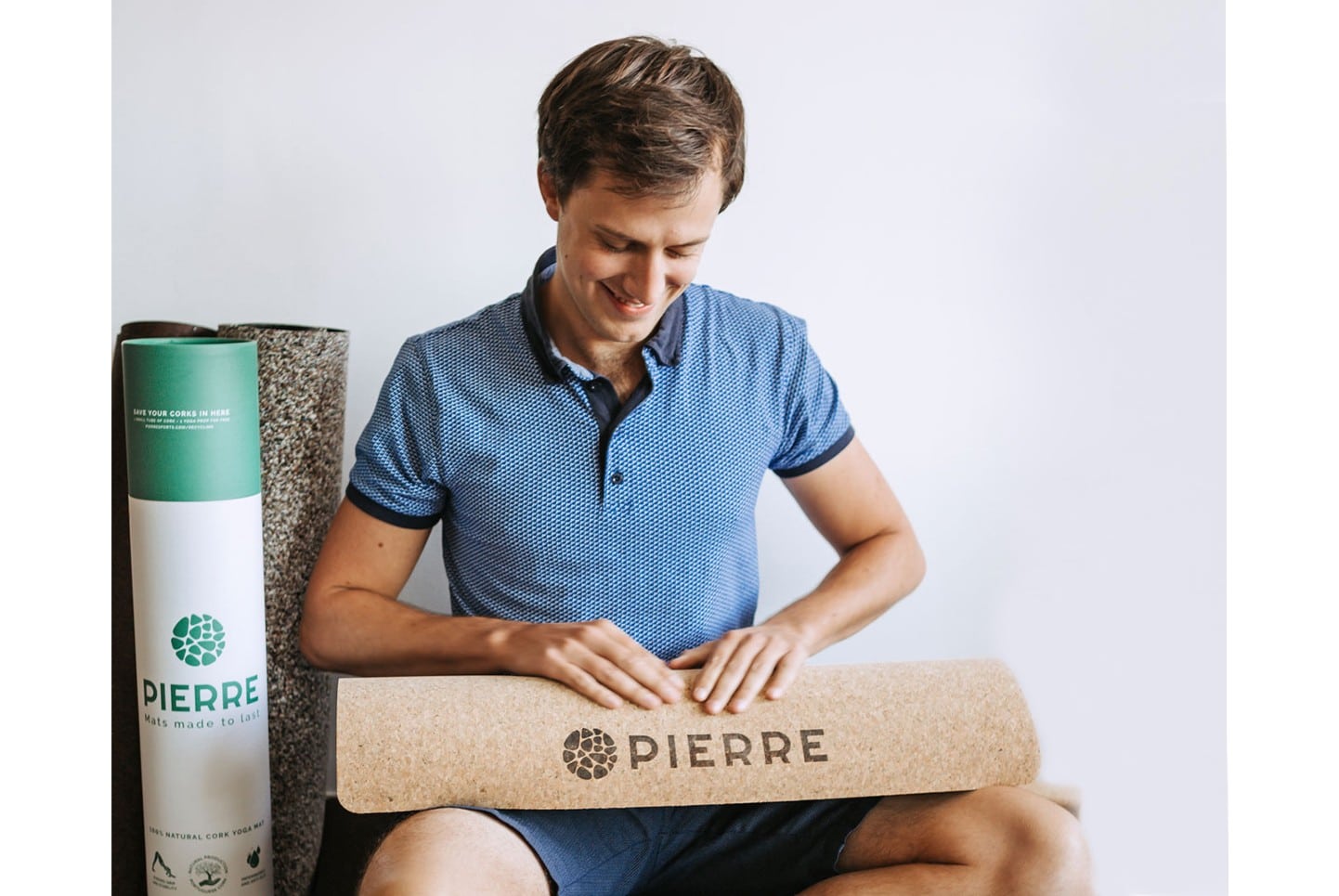 Man Holding PIERRE Cork Yoga Mat
