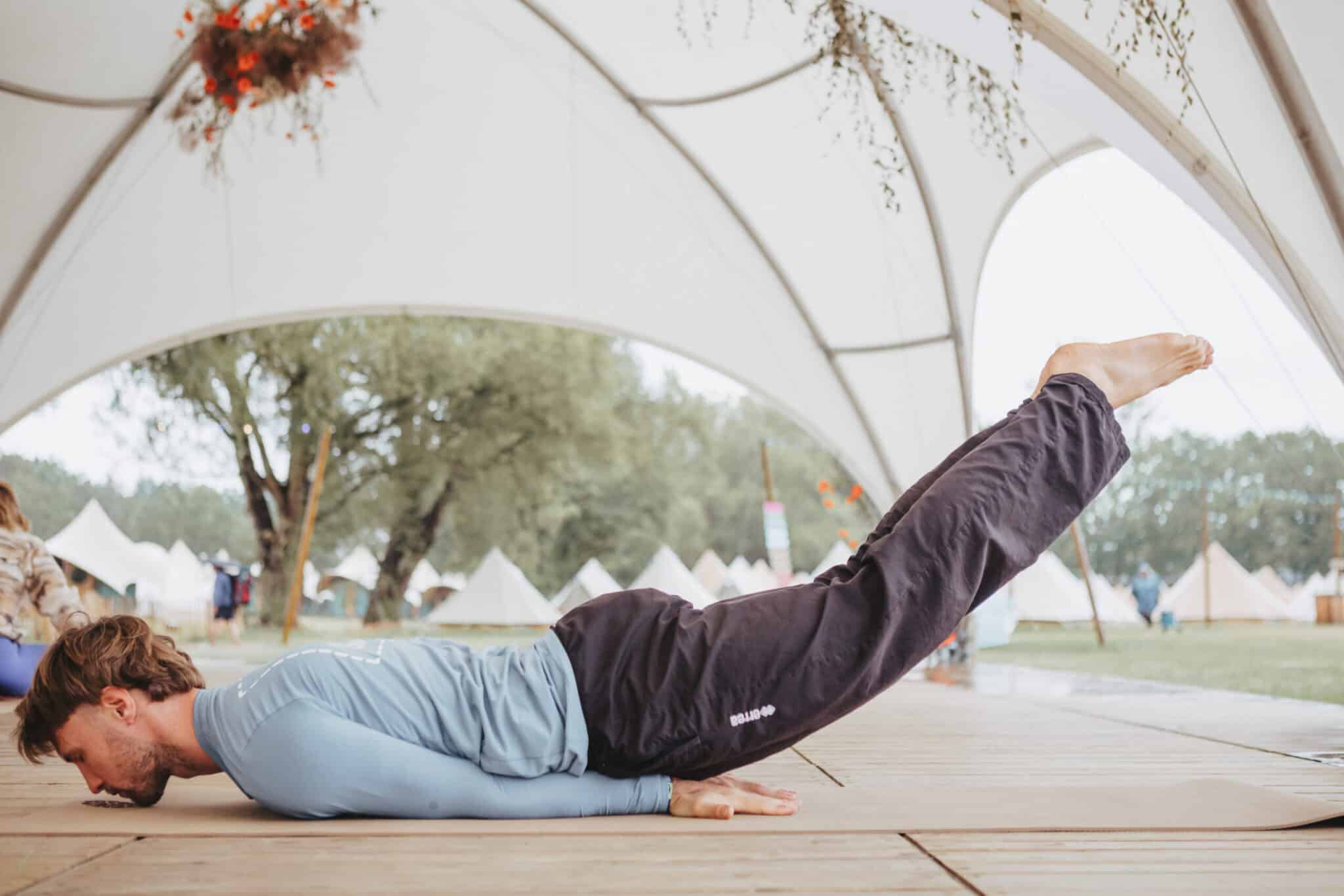 Man Performing Locust Pose on PIERRE Mat
